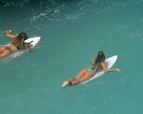 female surfing at beach